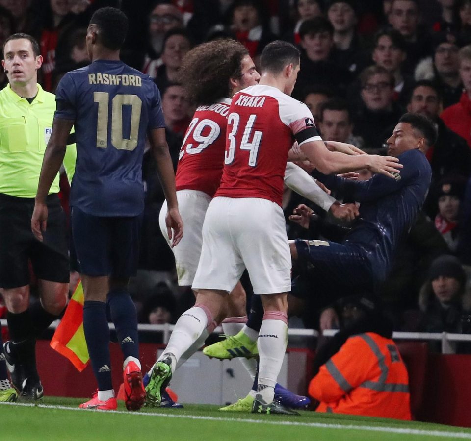  Jesse Lingard was shoved towards the hoardings as a brawl broke out during the FA Cup clash