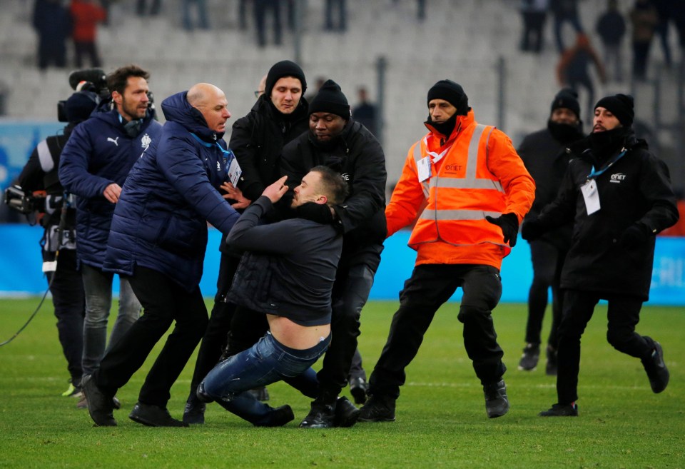 One protester run onto the pitch and had to be stopped by stewards