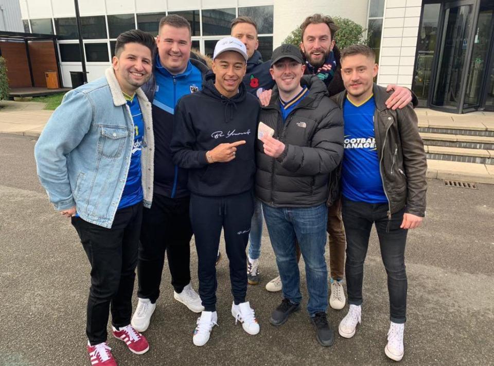  Jesse Lingard poses with the AFC Wimbledon fans after paying them £600 of his own money