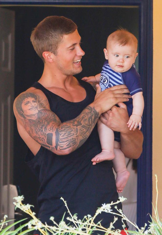  Dan, pictured with son Teddy, had a full sleeve tattoo devoted to Jacko