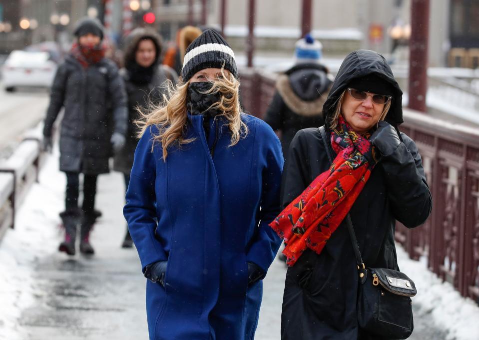  A couple of woman brave the freezing weather as they walk along Michigan Avenue in Chicago