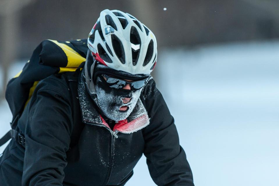  A cyclist passes through heavy frost in Nokomis parkway, south west Minneapolis, as temperatures in the area dipped below freezing overnight in Minnesota