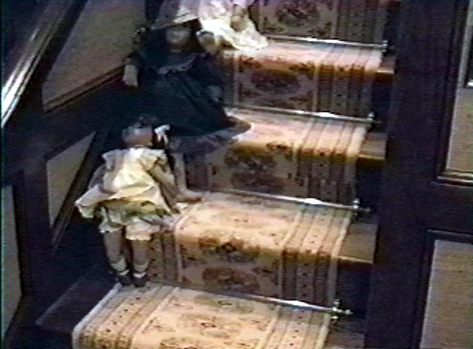  Children's dolls can be seen sitting on a stairwell in a room at Michael Jackson's Neverland