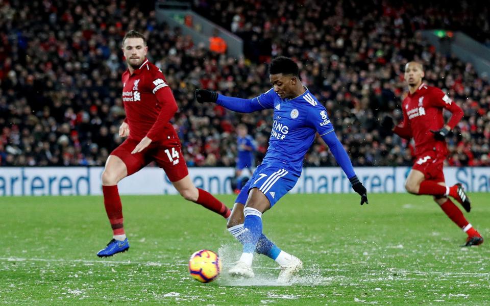  Demarai Gray struggles to kick the ball through the snow on the pitch