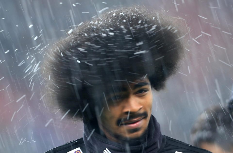  Leicester's Hamza Choudhury is caught in the mini Anfield blizzard