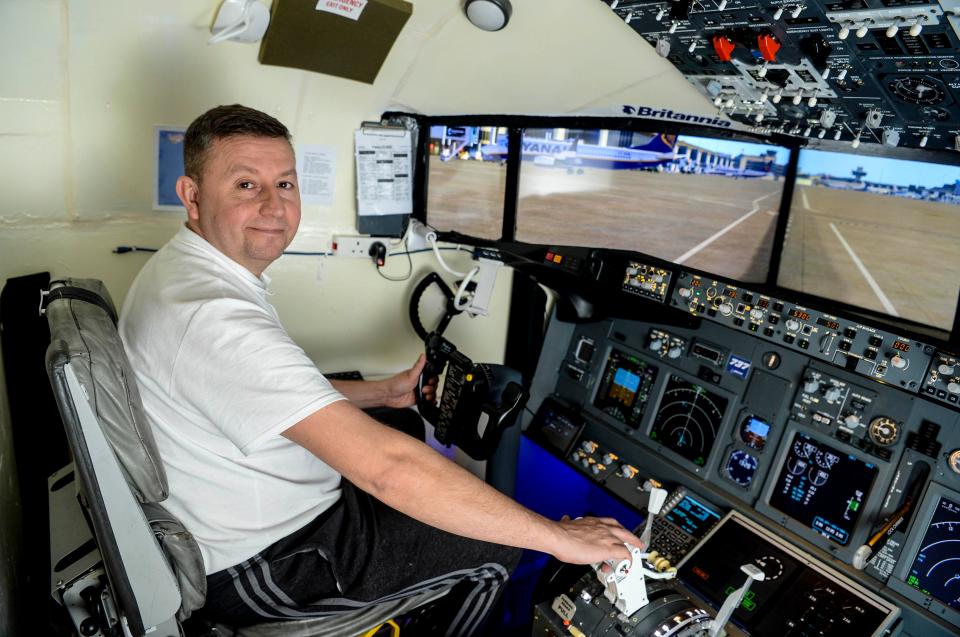  Flight-sim fan David Naylor sat in the cockpit he's built in what used to be his dining room