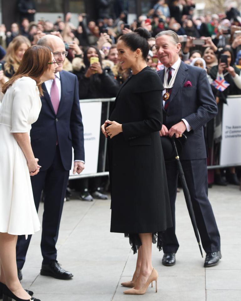  The Duchess beamed as she was greeted by staff