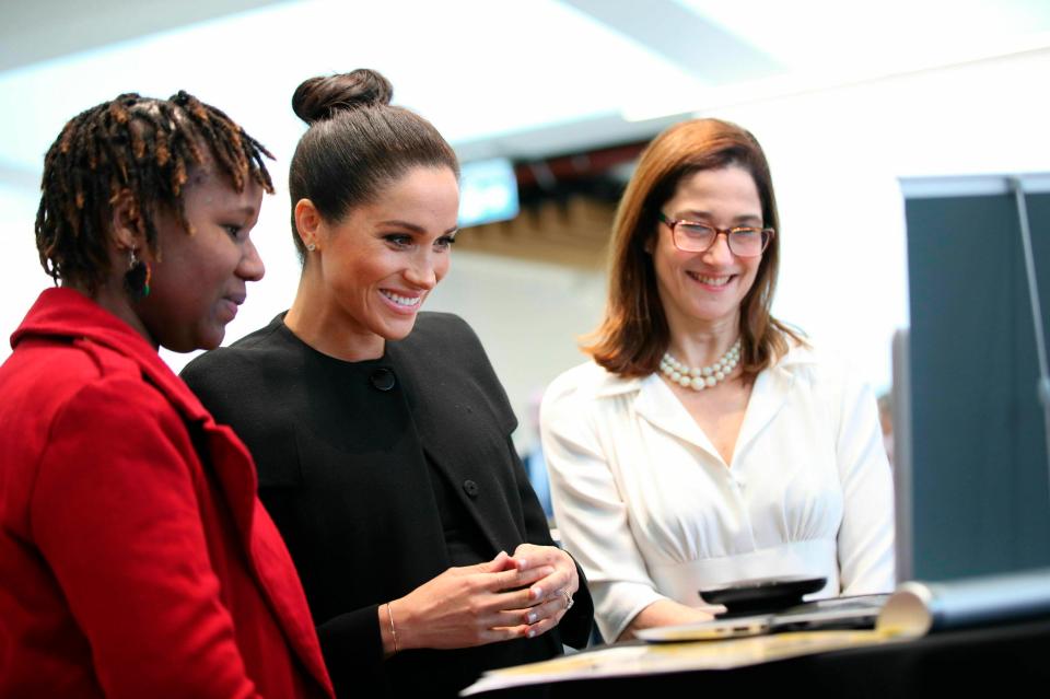  The beaming duchess spoke with staff and students