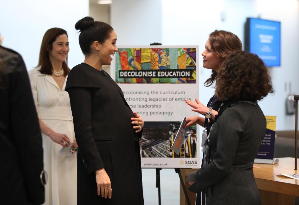  Meghan Markle laughing heartily as she chatted with people at the Association of Commonwealth Universities