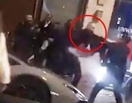  The footage shows the doorman punching and kicking out at the men outside the plush Mayfair property