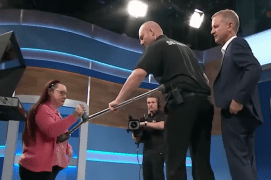  Jeremy Kyle's security guard was forced to step in and block an angry mum who tried hitting him with her crutch