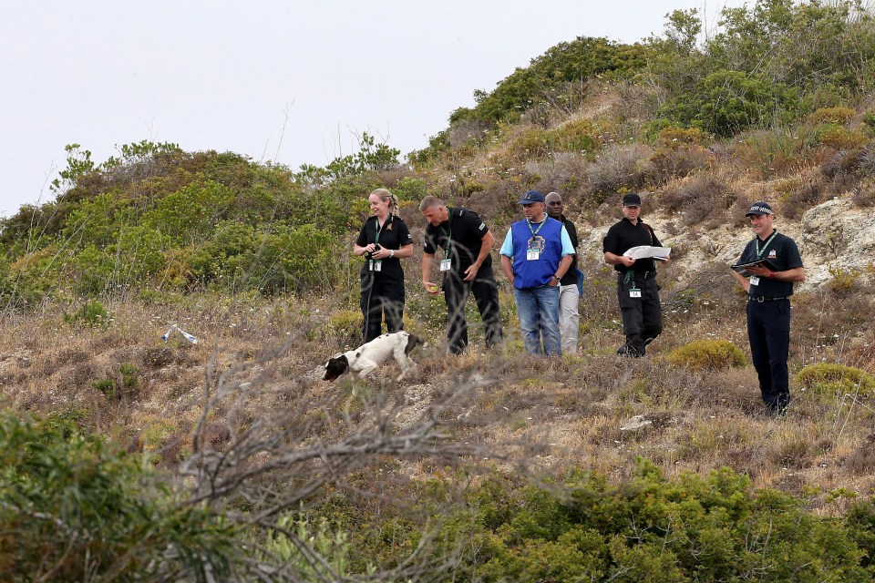 British police searches the ground for missing British girl Madeleine McCann in Praia da Luz in 2014