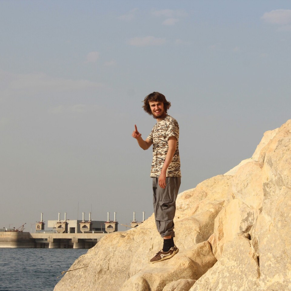  Doing ISIS's trademark gesture, Jack poses in Syria