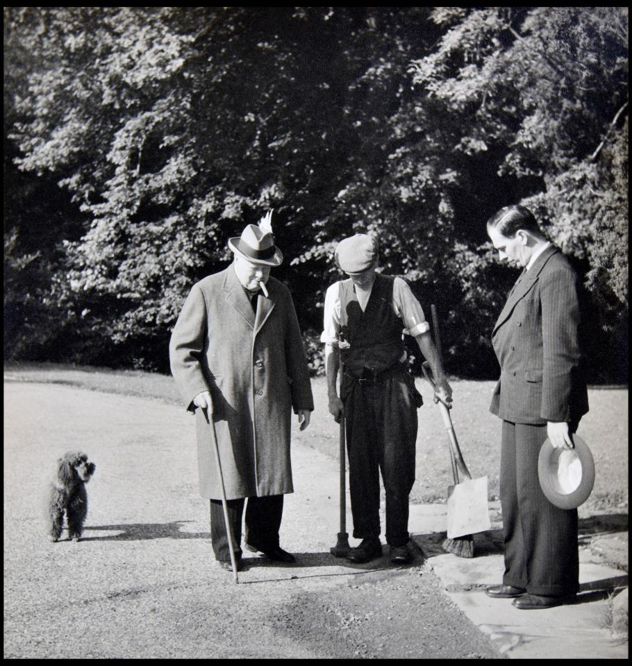 Churchill (left) inspecting the grounds of his Chartwell residence