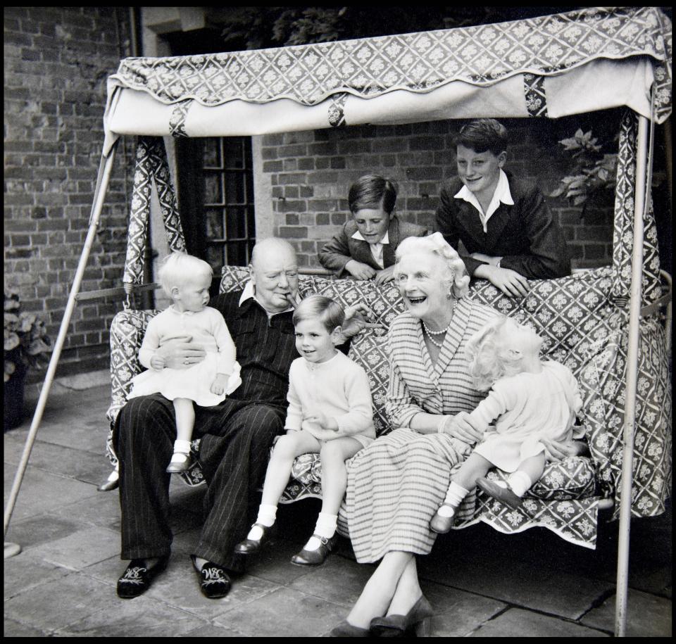 Winston Churchill with his wife Clementine and five of his grandchildren