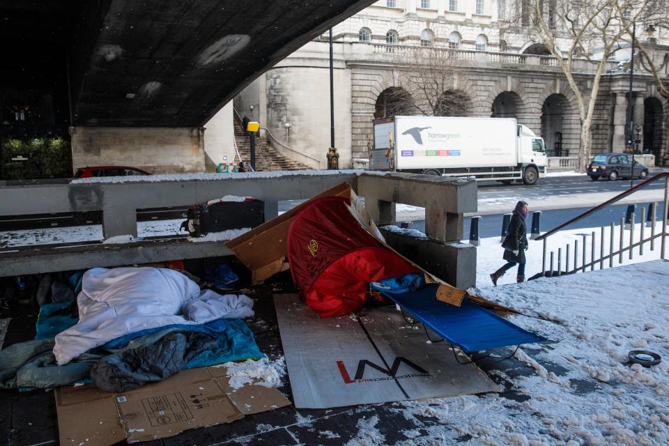  Bedding and shelters belonging to homeless people lie under a bridge on the Embankment in London in 2018