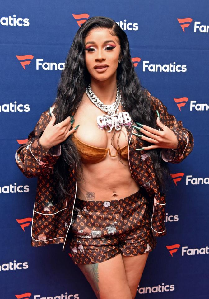  Cardi teamed a brown bra with Louis Vuitton hotpants and a matching suit jacket