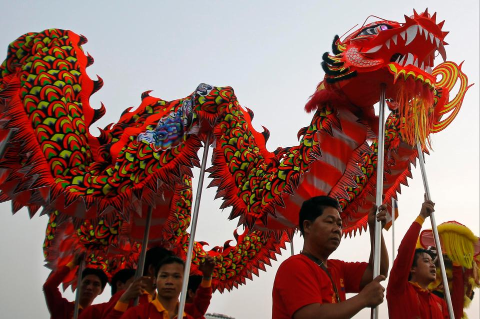  Members of Cambodia's Chinese community perform a traditional dragon dance