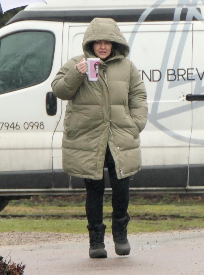  EastEnders' Lacey Turner struggled to keep warm during filming and clutched a cup of tea while wearing two coats