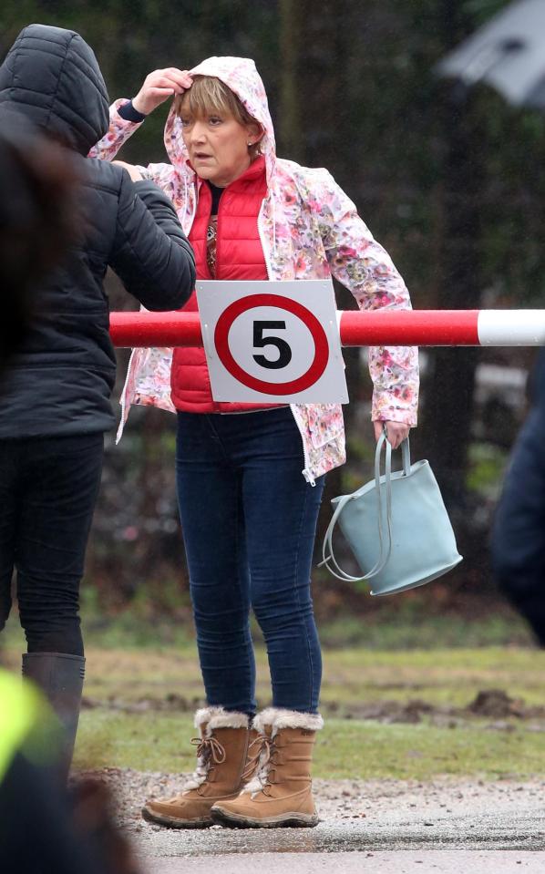  The actress wore a bright red gilet and colourful rain coat for her scenes