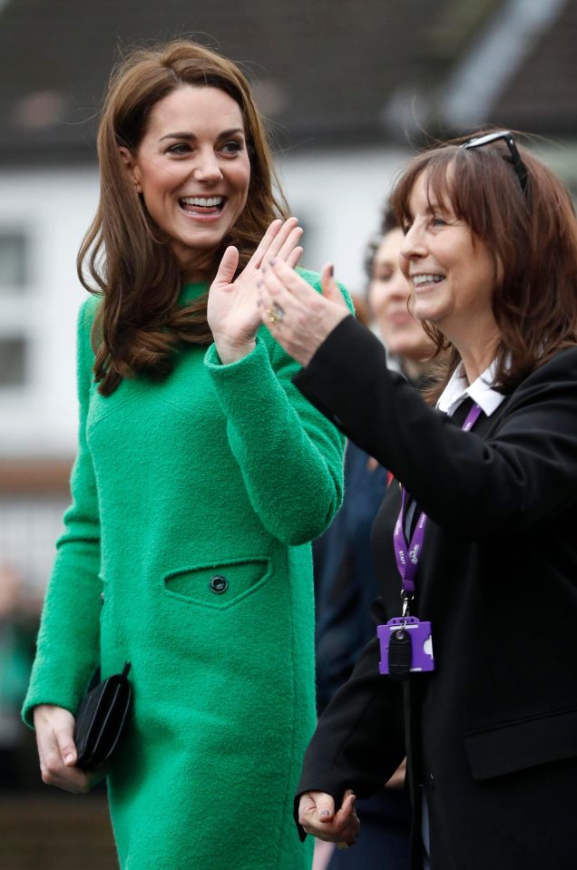  She waved happily at crowds gathered at the London school gate