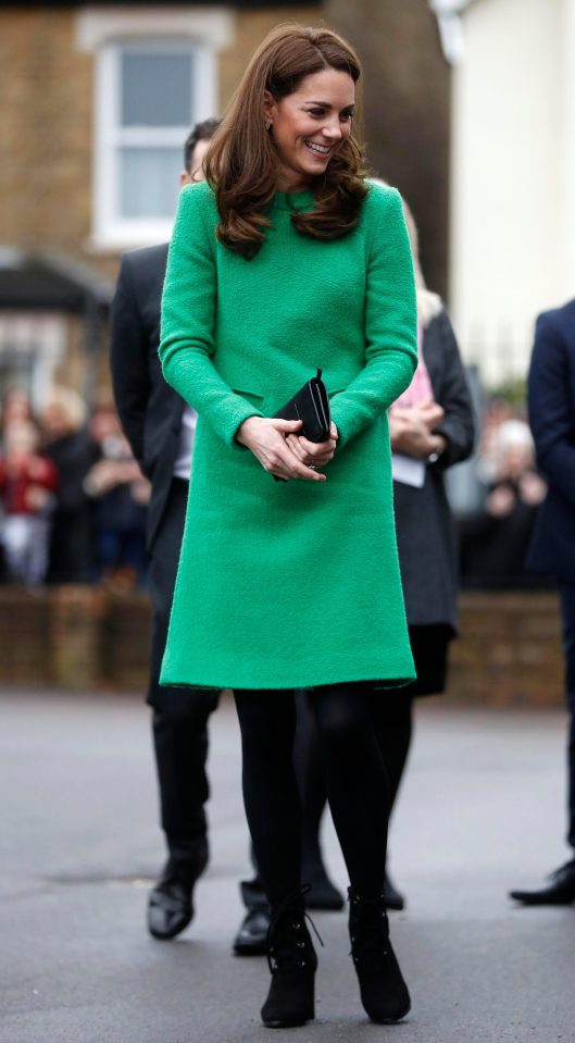  She wrapped up warm with a bright green dress and tights for the morning visit