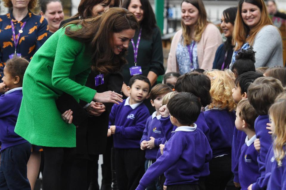  She smiled and chatted happily to the gaggle of schoolkids in London