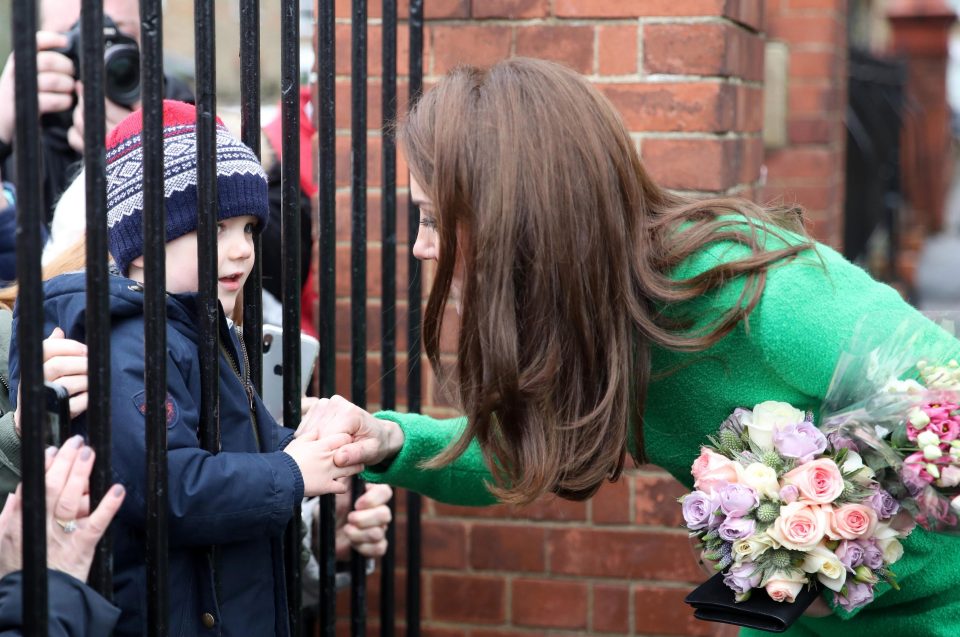  Kate shook hands with a young royal fan as crowds gathered outside the school