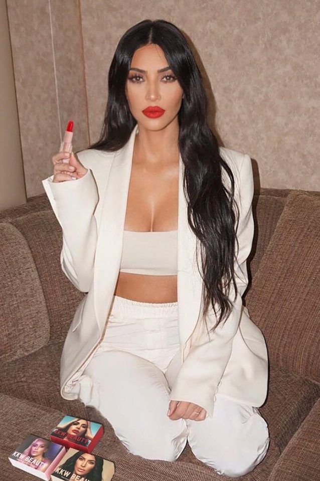  Kim Kardashian teams a white suit with her own range of red lipstick