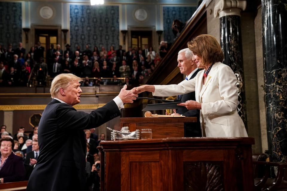  The under-fire President shakes hands with the outspoken speaker