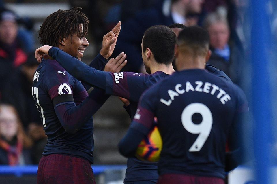  Alex Iwobi celebrates his opening goal against Huddersfield