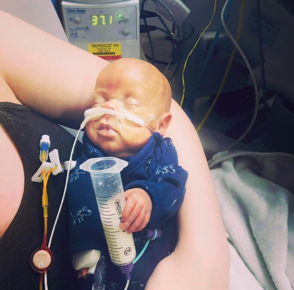  Nine-month-old George has made a miracle recovery and is now living at home with his mum and dad