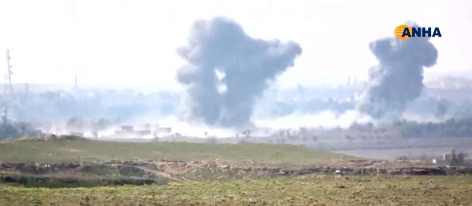 Black plumes of smoke rise above the battle zone in and around the village of Baghouz