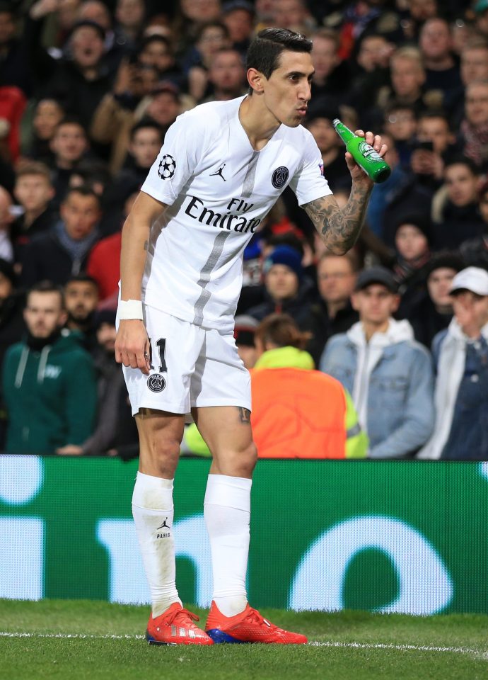 The Argentine pretends to take a sip from a beer bottle thrown at him from the home section