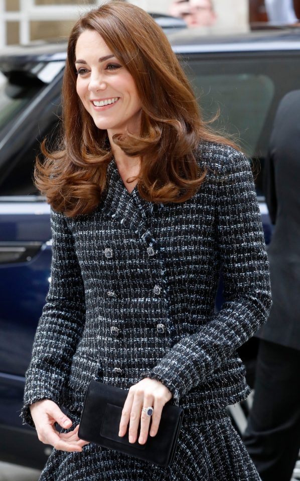 Kate Middleton today smiled as she arrived at the conference