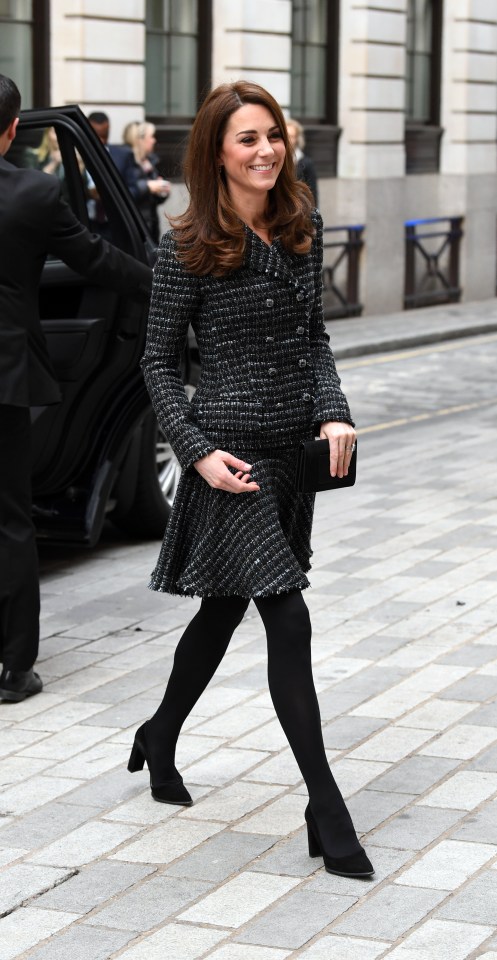 The mum-of-three wore a dark plain blazer and skirt for the conference