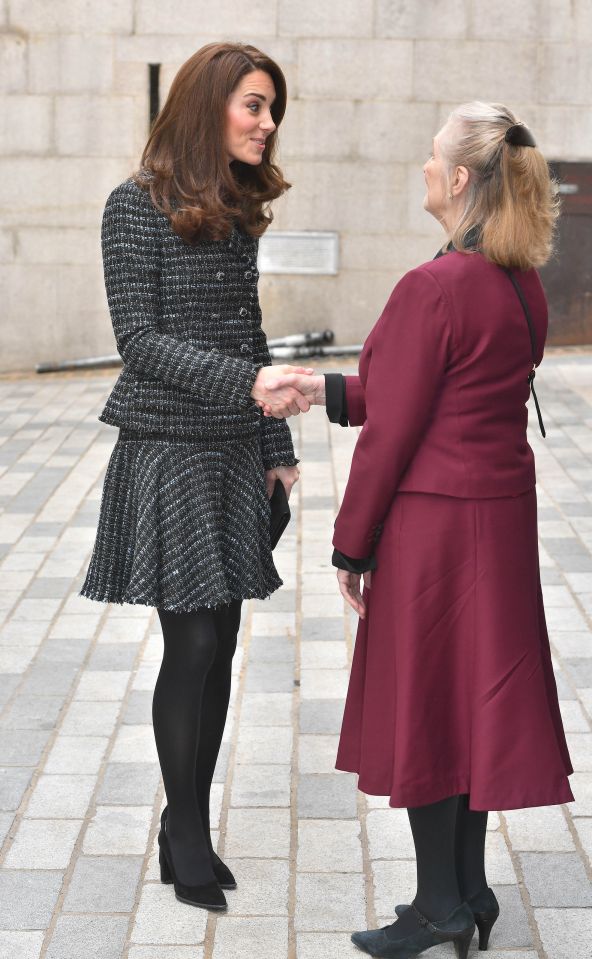 Kate Middleton is greeted by Xenia Violet Dennen as she arrives at Mercer's Hall in London