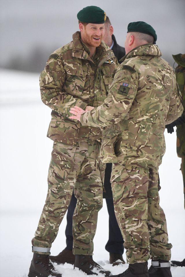  The 34-year-old was bundled up in warm camo gear for the visit