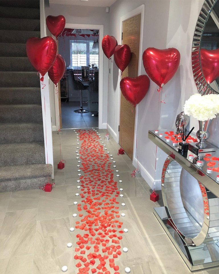  Her house was filled with love heart balloons, rose petals and candles