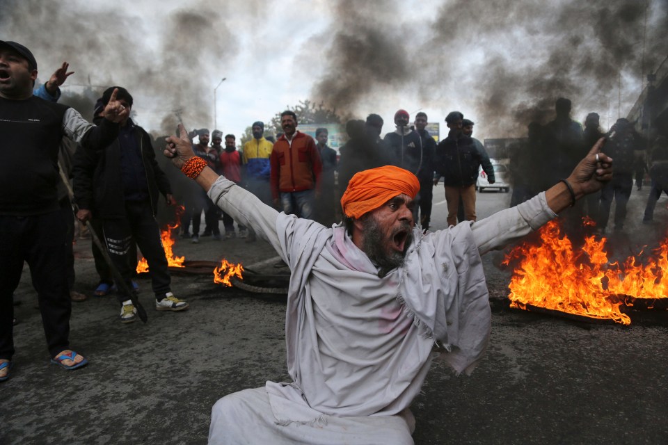  A protestor in Jammu, India shouts slogans against the February 14 attack on a paramilitary convoy