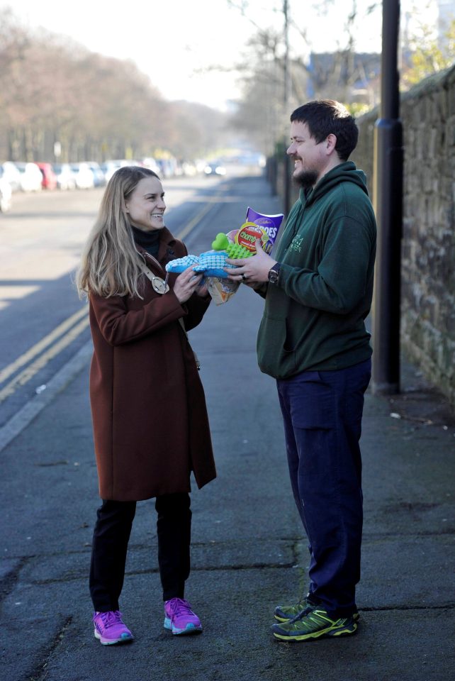 Our Laura gives free dog toys and some chocolates to Newcastle Cat and Dog Shelter volunteer Matthew Davison