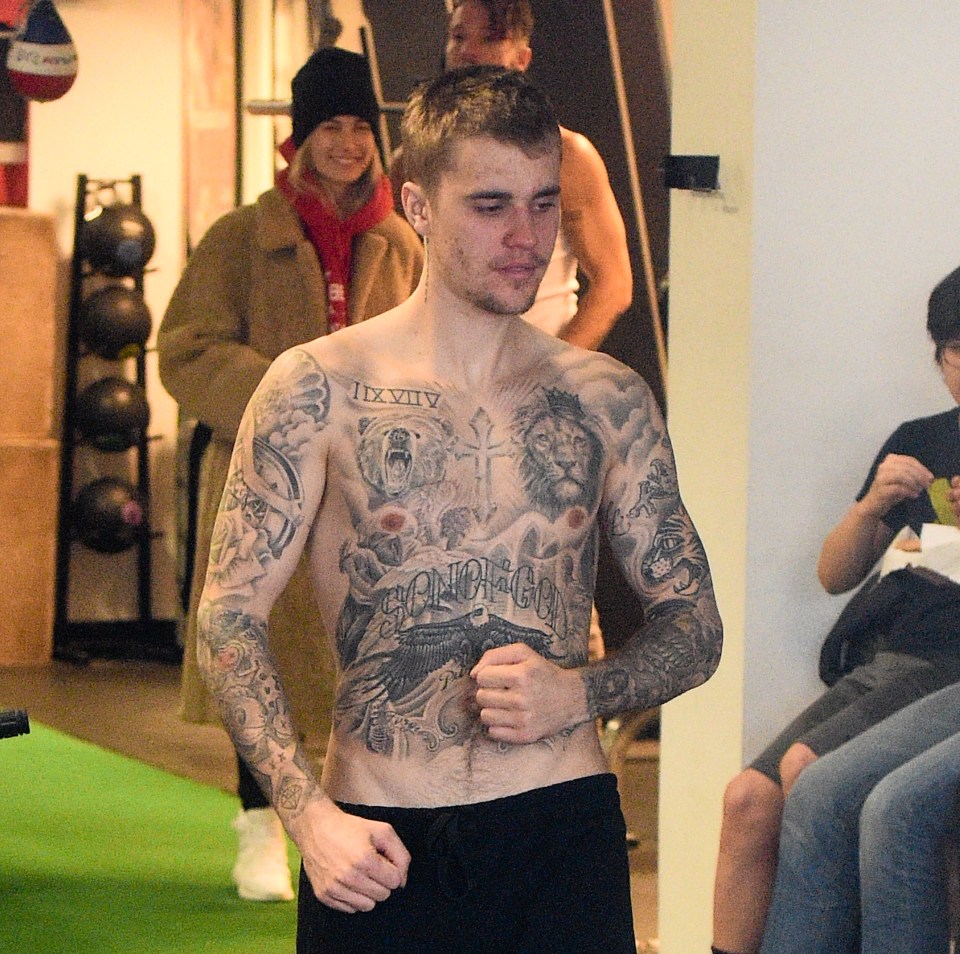 Justin Bieber has shown off his extensive tattoo work during a shirtless stint at the gym