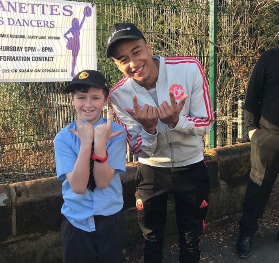  Lingard does his signature pose after buying locals kids in Warrington treats