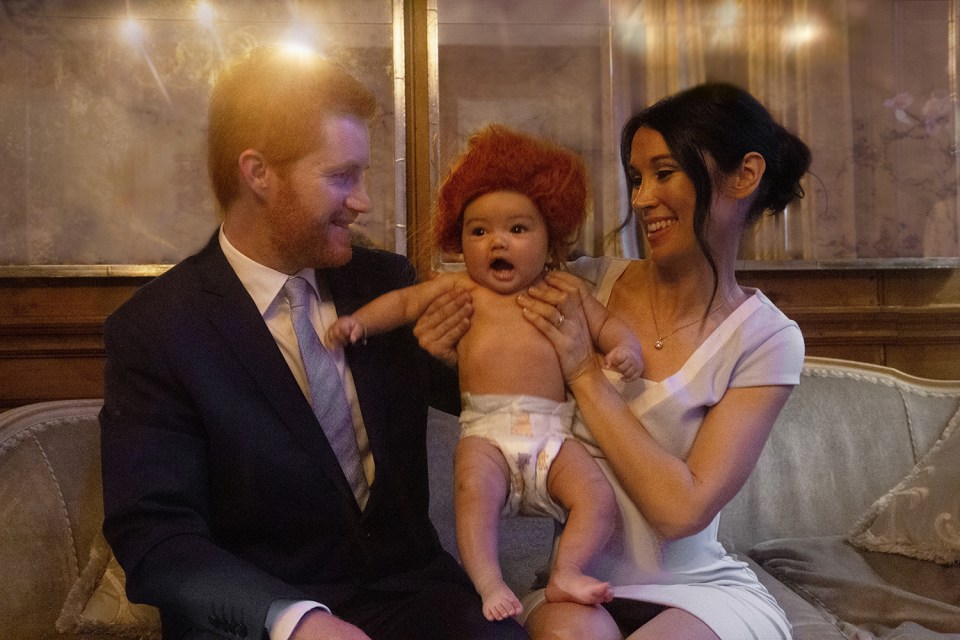  In another shot, the 'duke and duchess' hold a baby that appears to have Prince Harry's trademark ginger locks