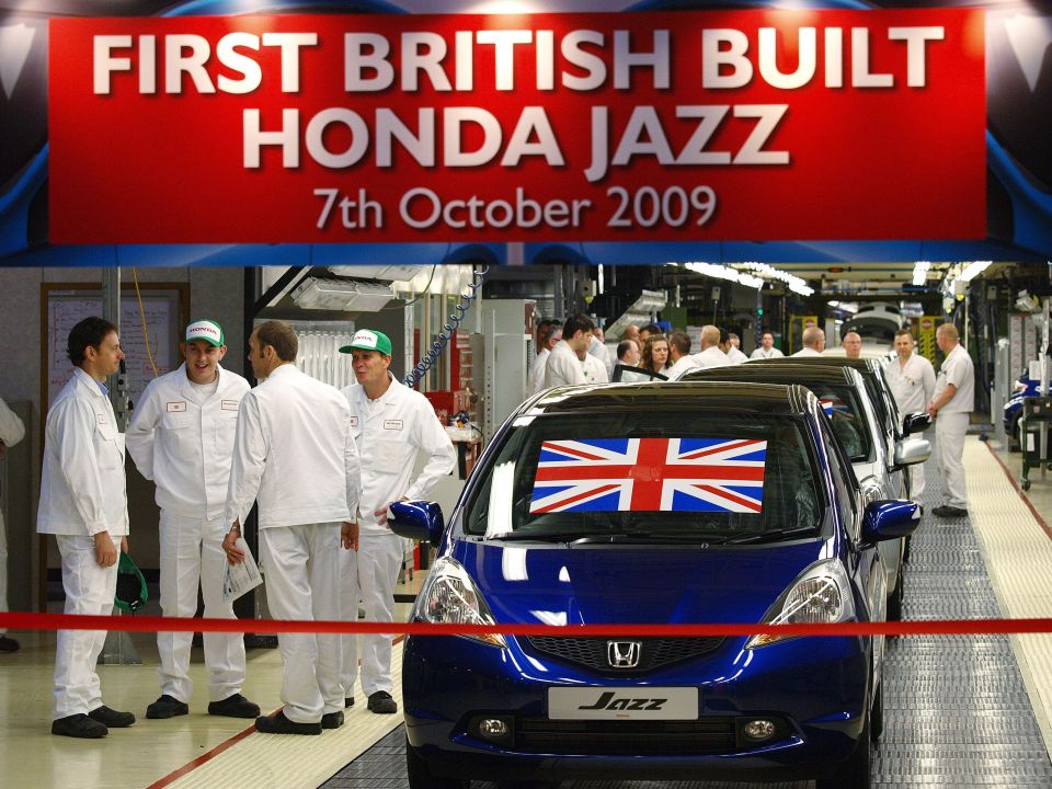  Workers wait for the launch of the first British built Honda Jazz built at the Swindon factory in 2009