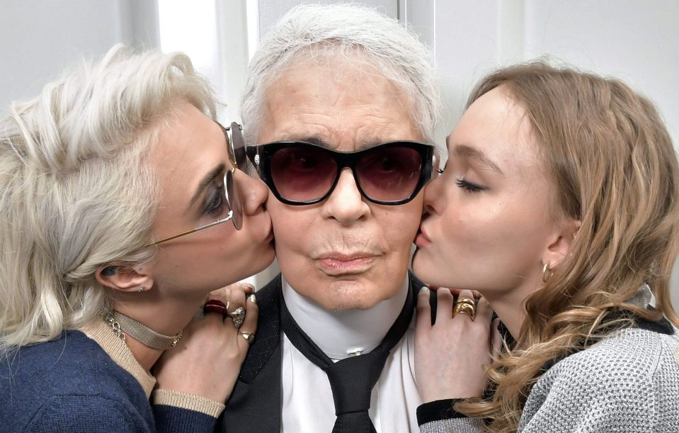  Lagerfeld gets a smooch from Cara Delevingne and Lily-Rose Depp