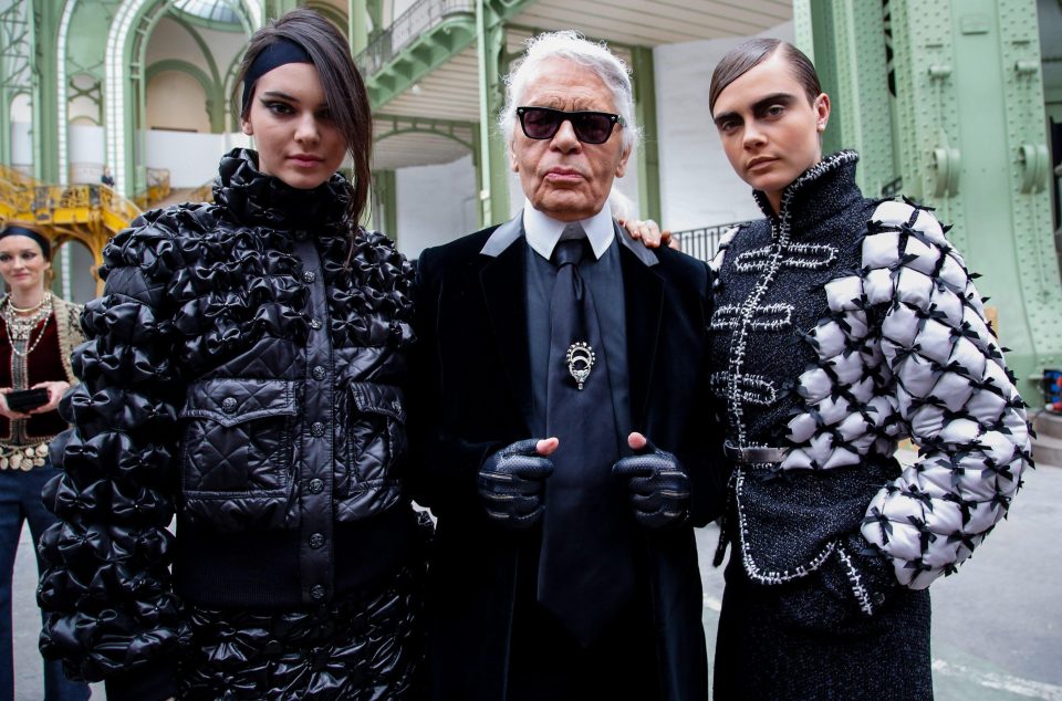  Lagerfeld pictured with supermodels Kendall Jenner and Cara Delevingne in 2015