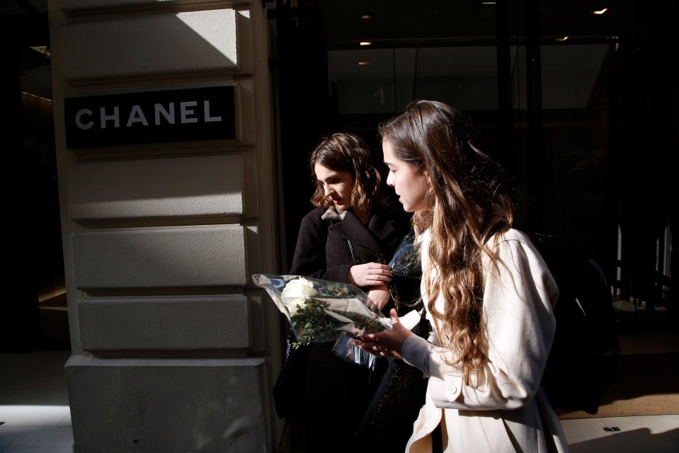  Wellwishers arrive outside the Chanel headquarters in Paris to pay tribute to the fashion mogul