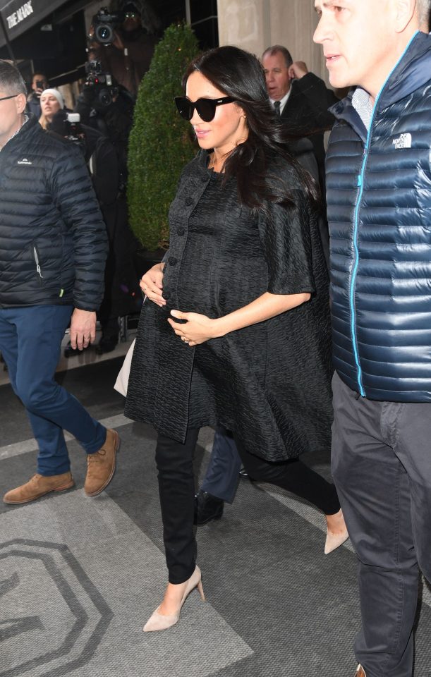  Meghan Markle stepped out of her New York hotel cradling her baby bump ahead of a baby shower