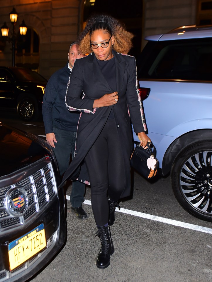 Serena wore a tailored black coat and military-style boots